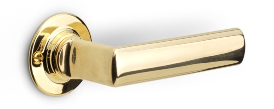 1929GRR50 - sprung lever handle on rose brass unlacquered