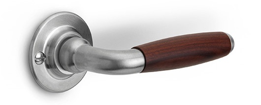 1932GRR50 - solid sprung door handle on round rose brass unlacquered/ebony wood